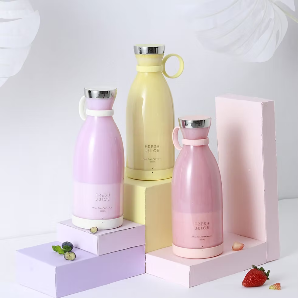 Three colorful water bottles with 'Fresh Juice' text on a white background